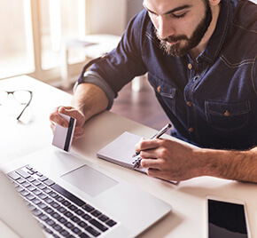 man paying a bill online