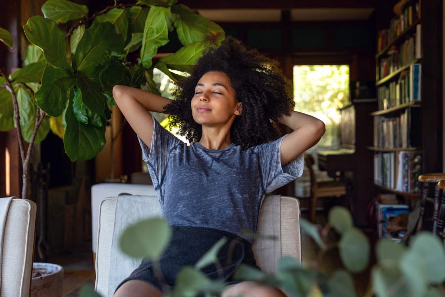 young woman relaxing and breathing better with invisalign