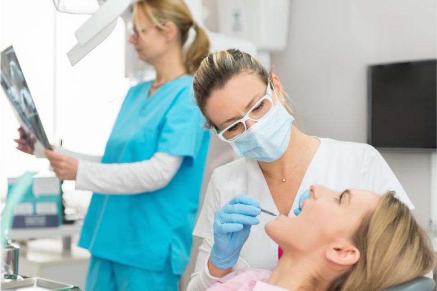 woman gets a regular dental checkup