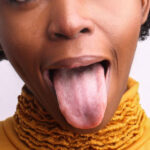 woman sticks out her tongue