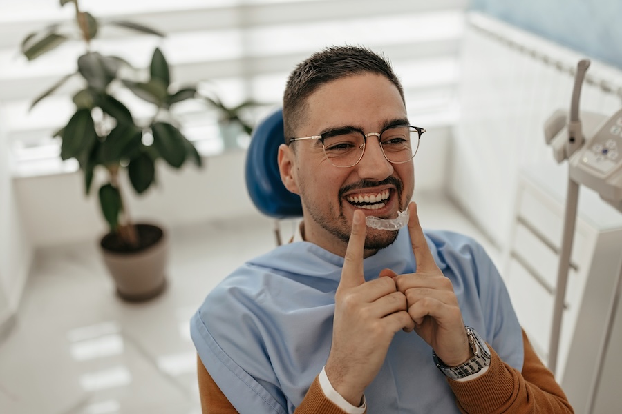 man using suresmile clear aligners