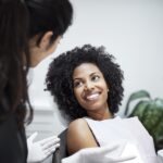 Black woman in dental chair for a dental cleaning