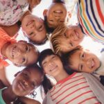 group of children smiling dental sealants and fluoride prevent cavities