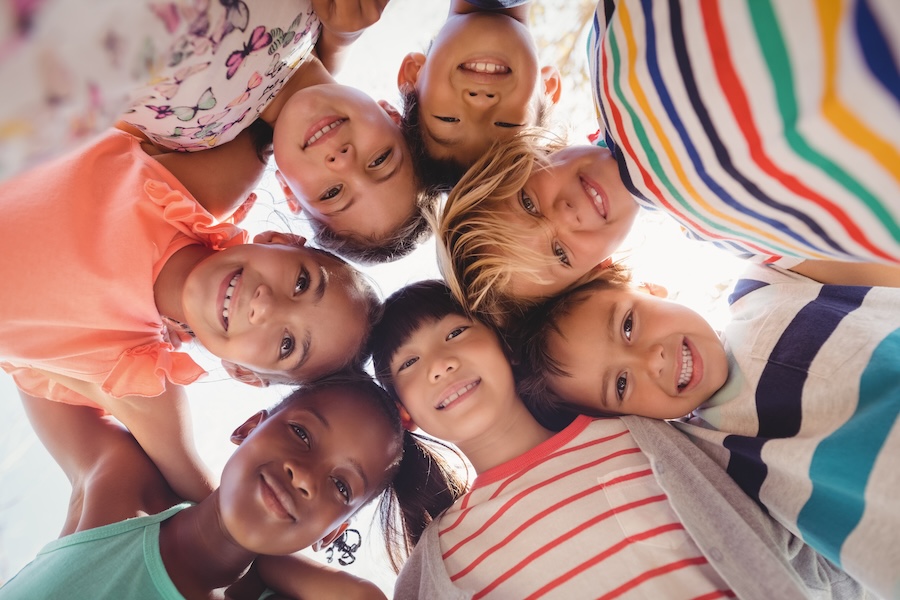 group of children smiling dental sealants and fluoride prevent cavities